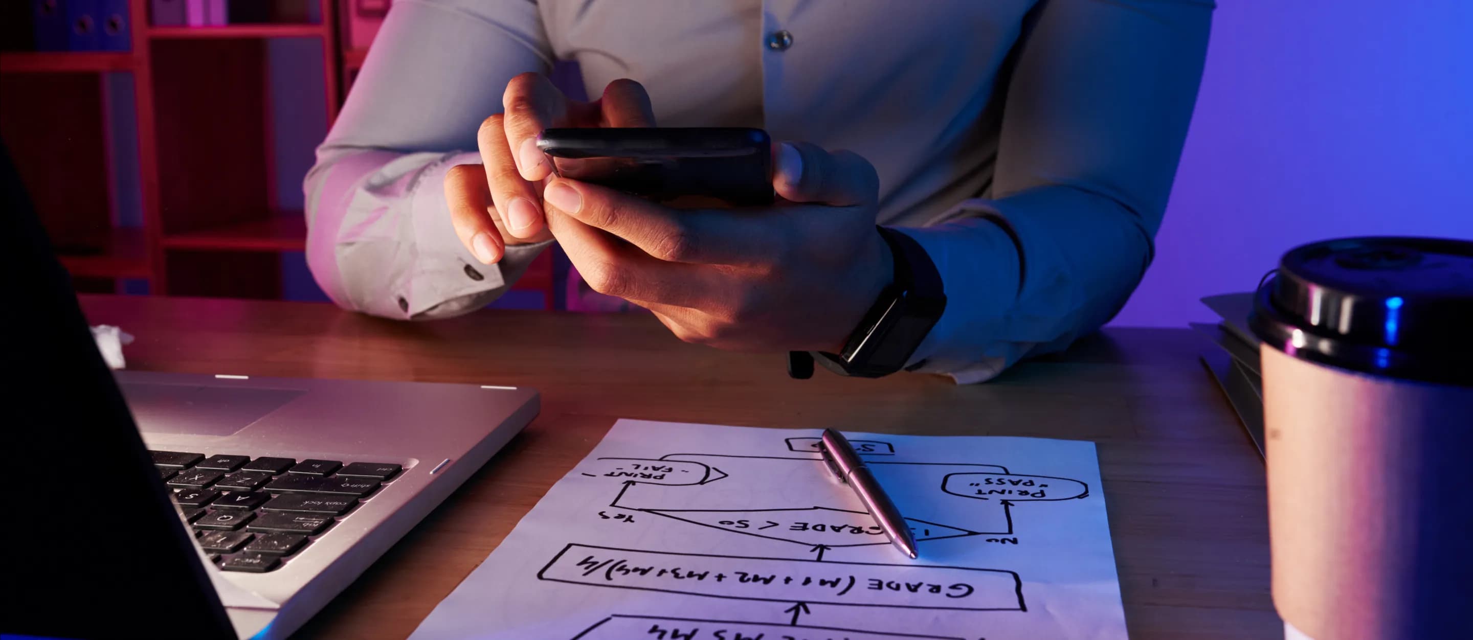 Man taking picture of work plan on phone